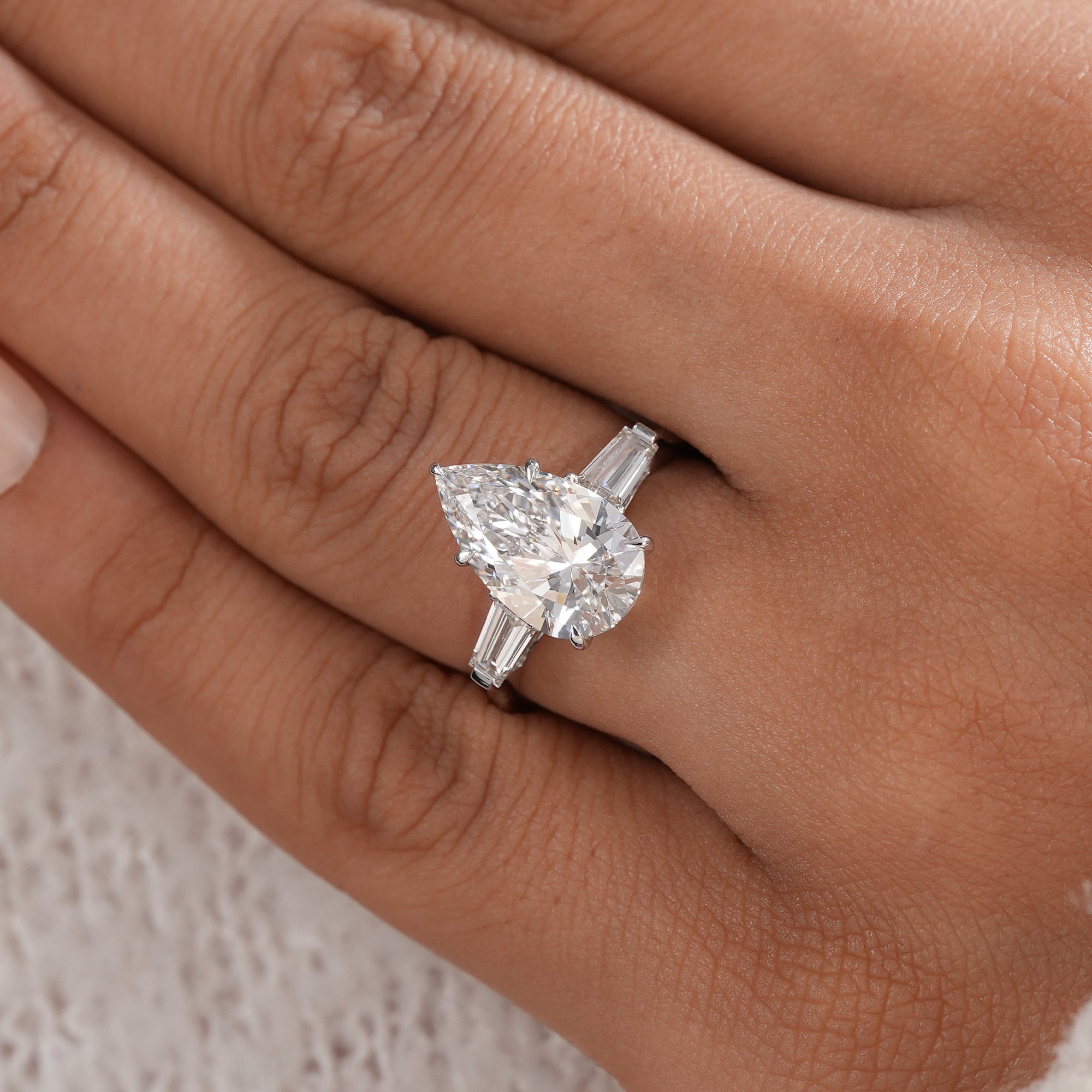 IGI certified pear lab diamond three stone engagement ring