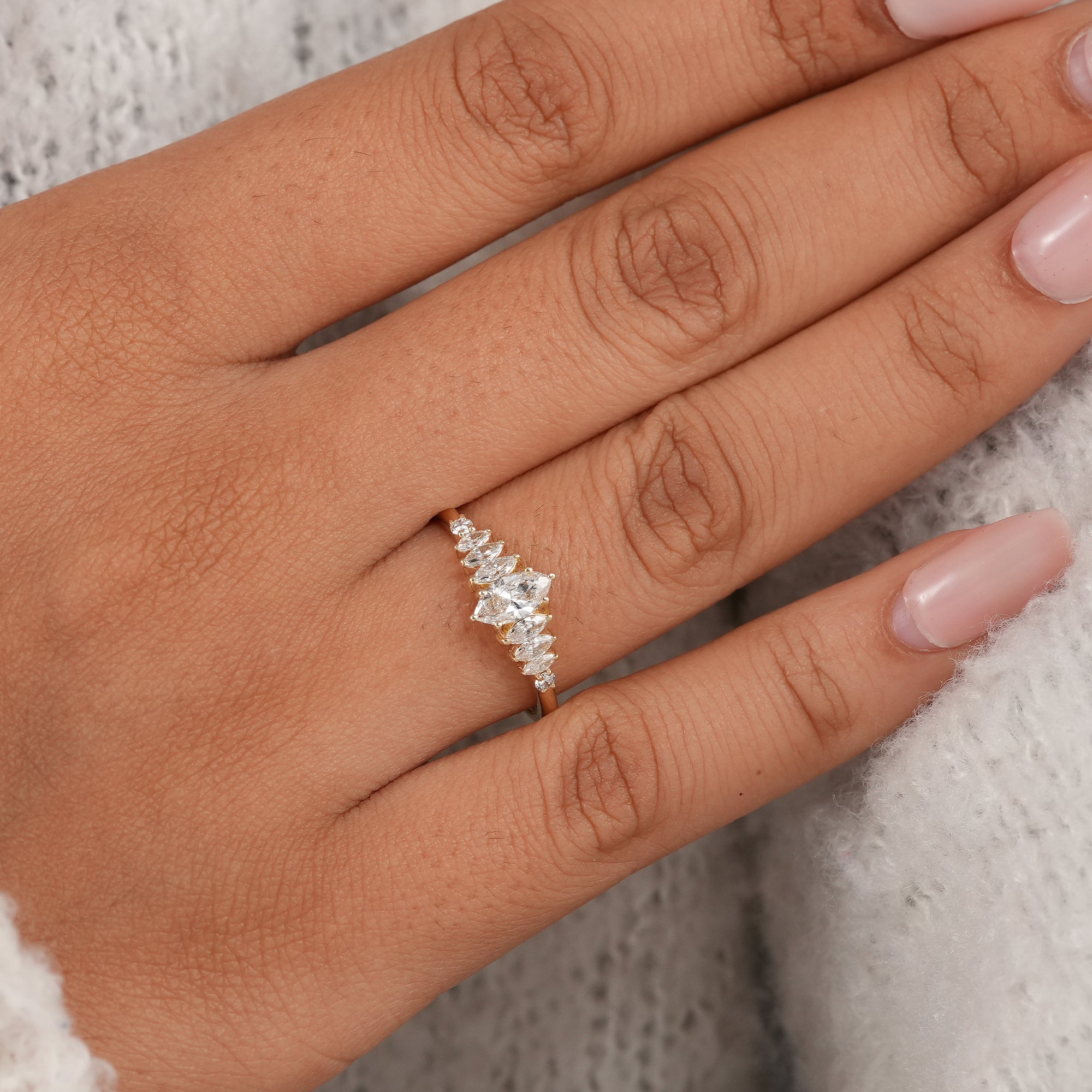 Classic marquise diamond wedding ring with brilliant side stones.