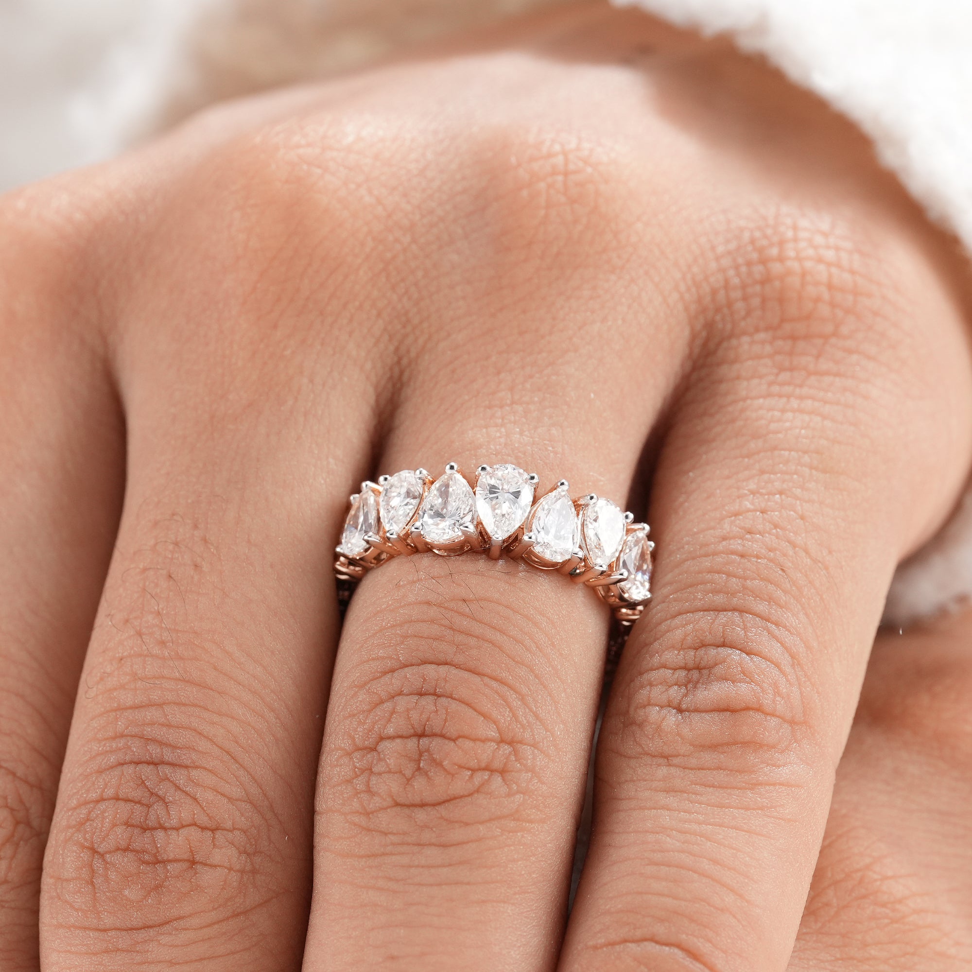 Luxury pear diamond ring with full eternity design.