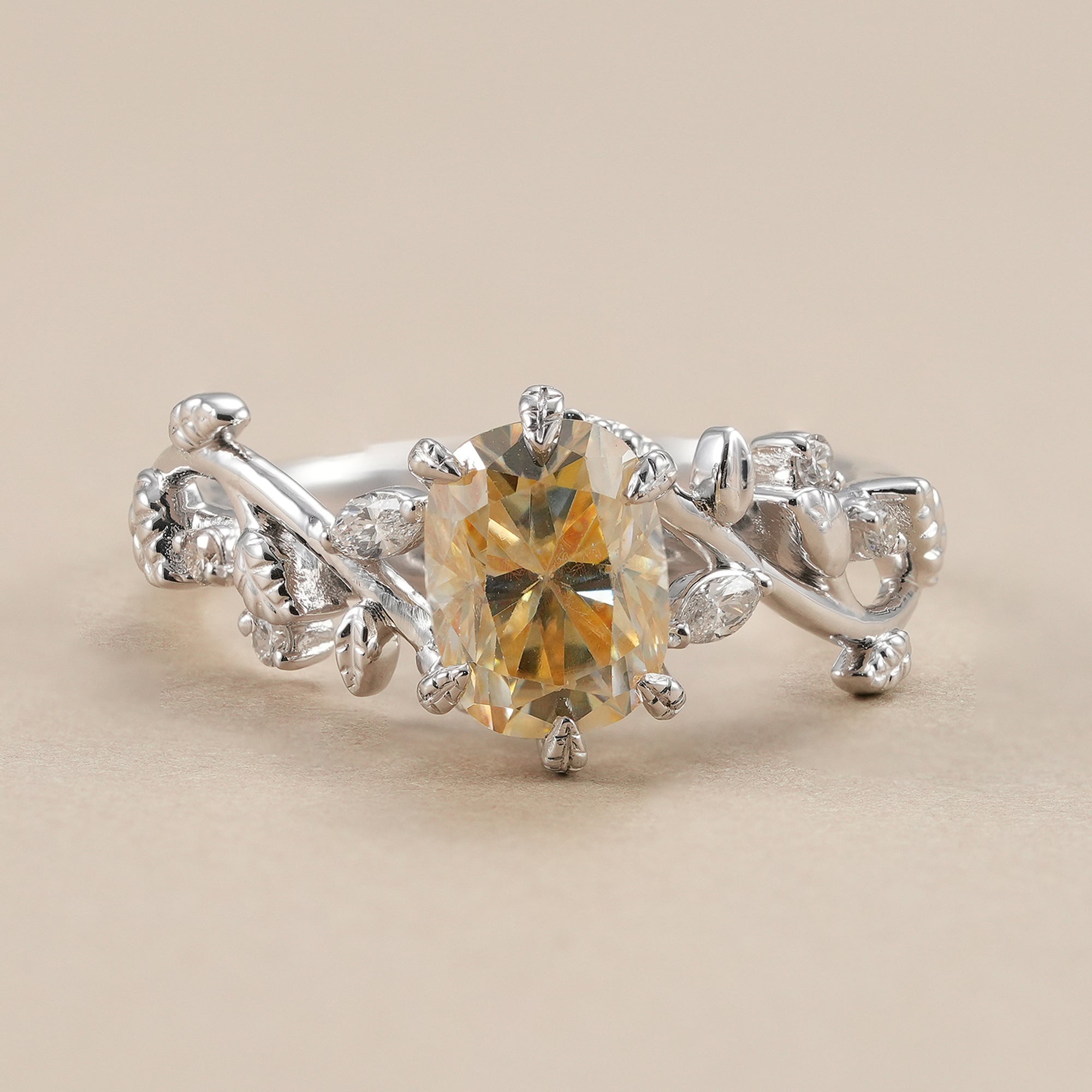 Yellow cushion lab grown diamond engagement ring with nature inspired leaf band.