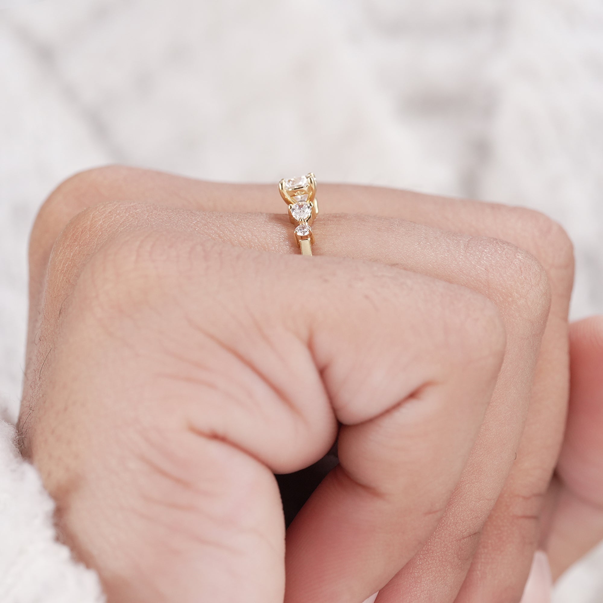 Classic engagement ring with five diamond arrangement