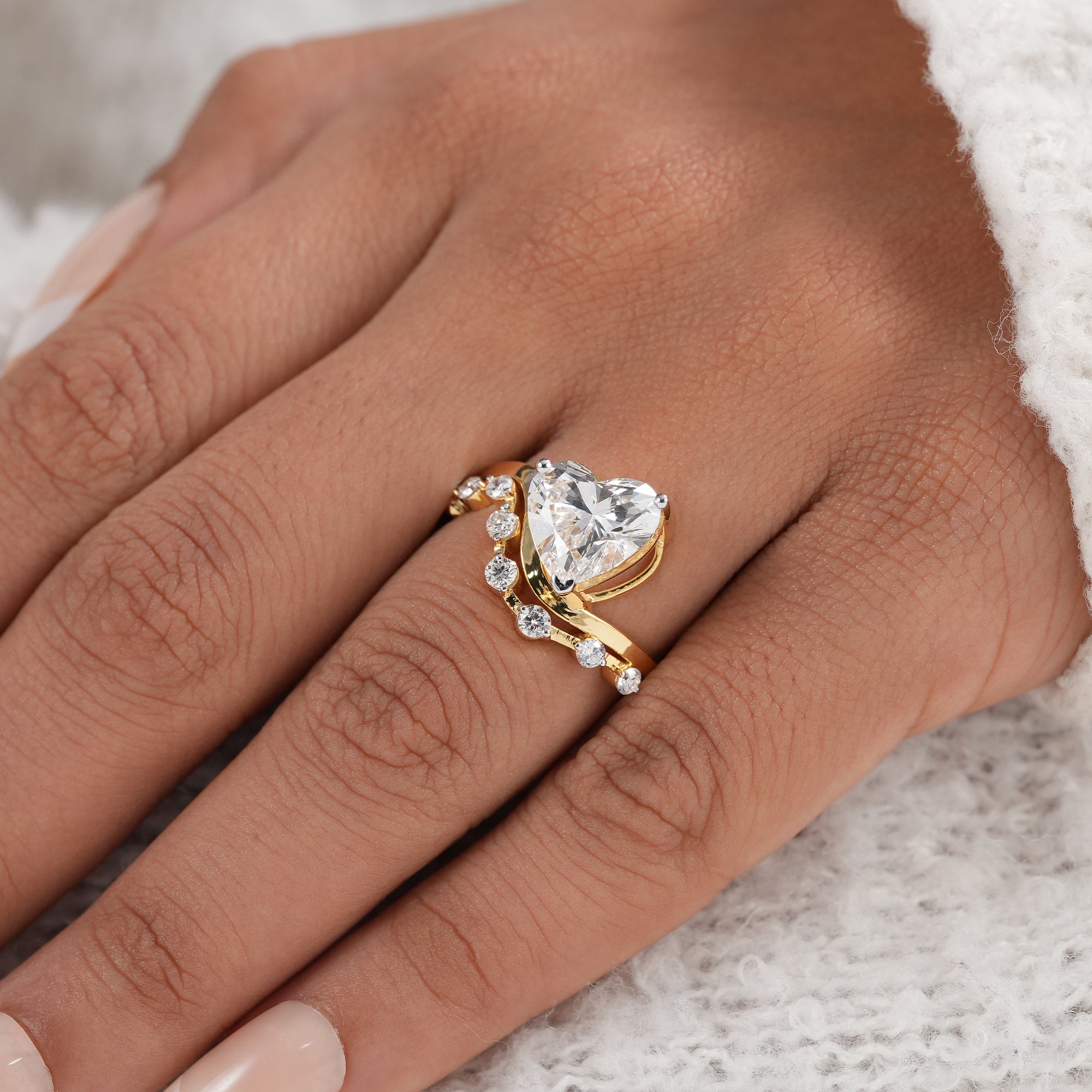 Yellow gold heart lab grown diamond engagement ring side view.