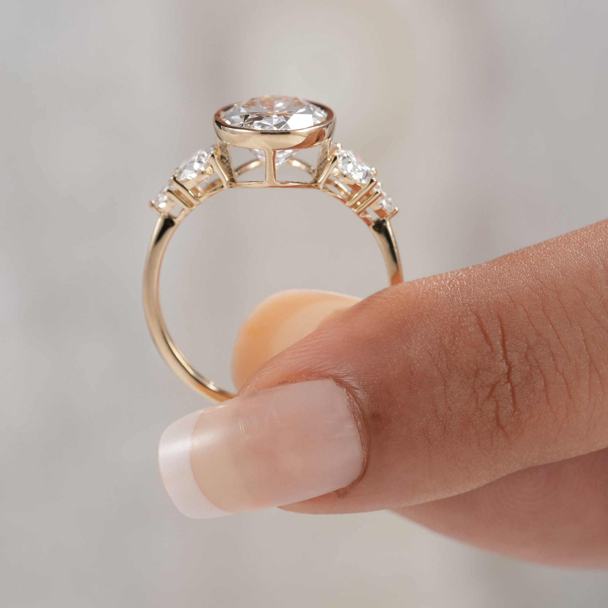 Classic anniversary diamond ring with oval center diamond