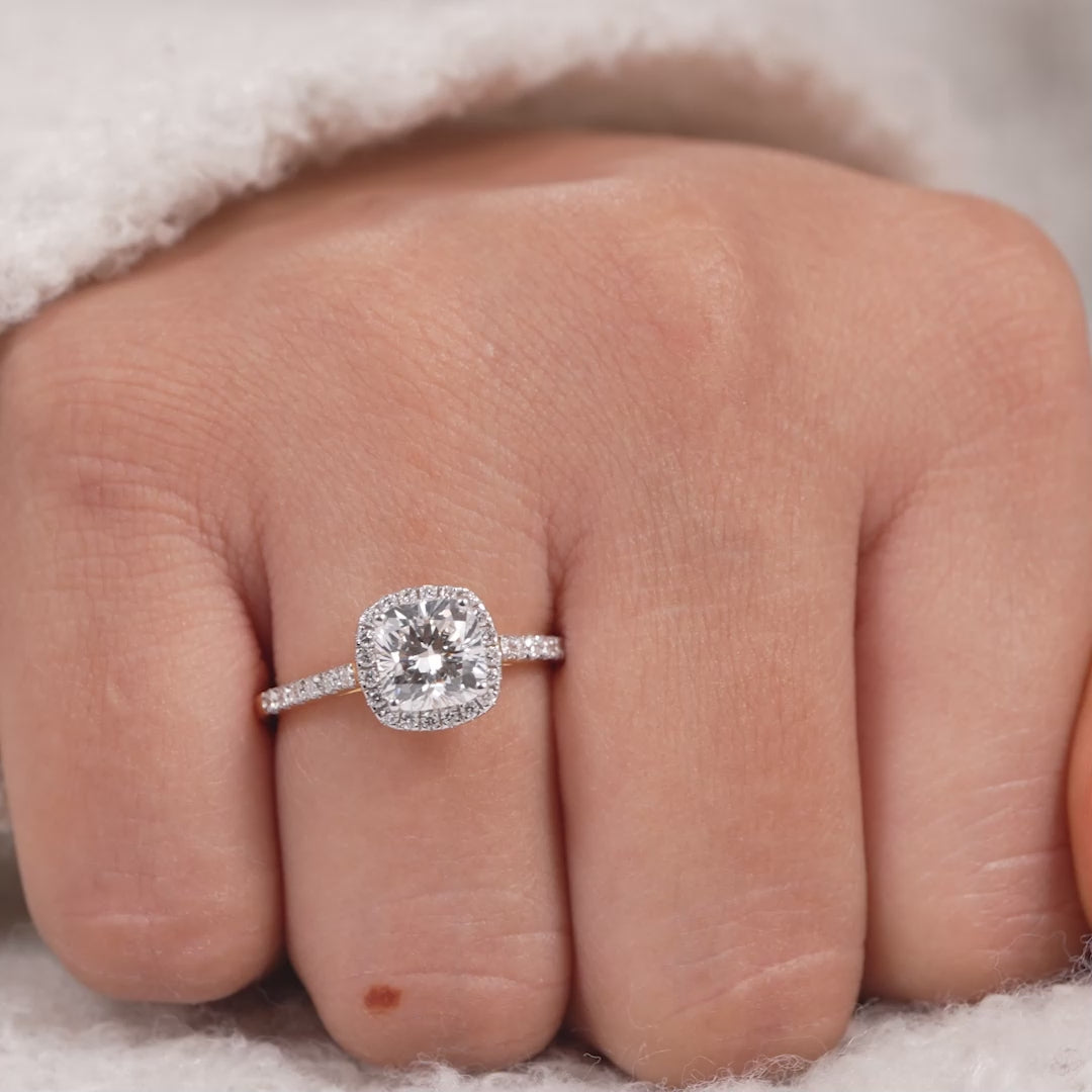 Elegant cushion cut diamond engagement ring with sparkling halo setting