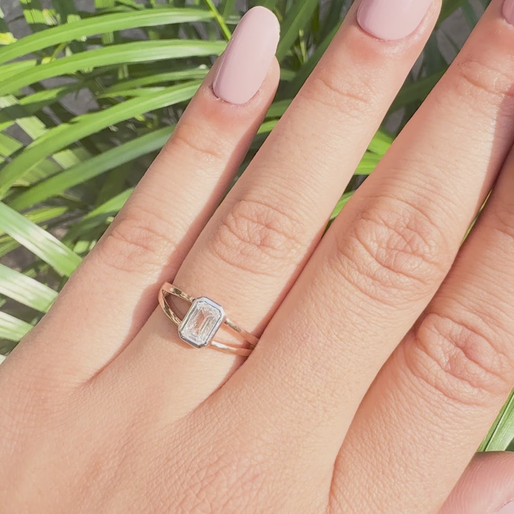 Emerald cut lab grown diamond solitaire ring with split shank design