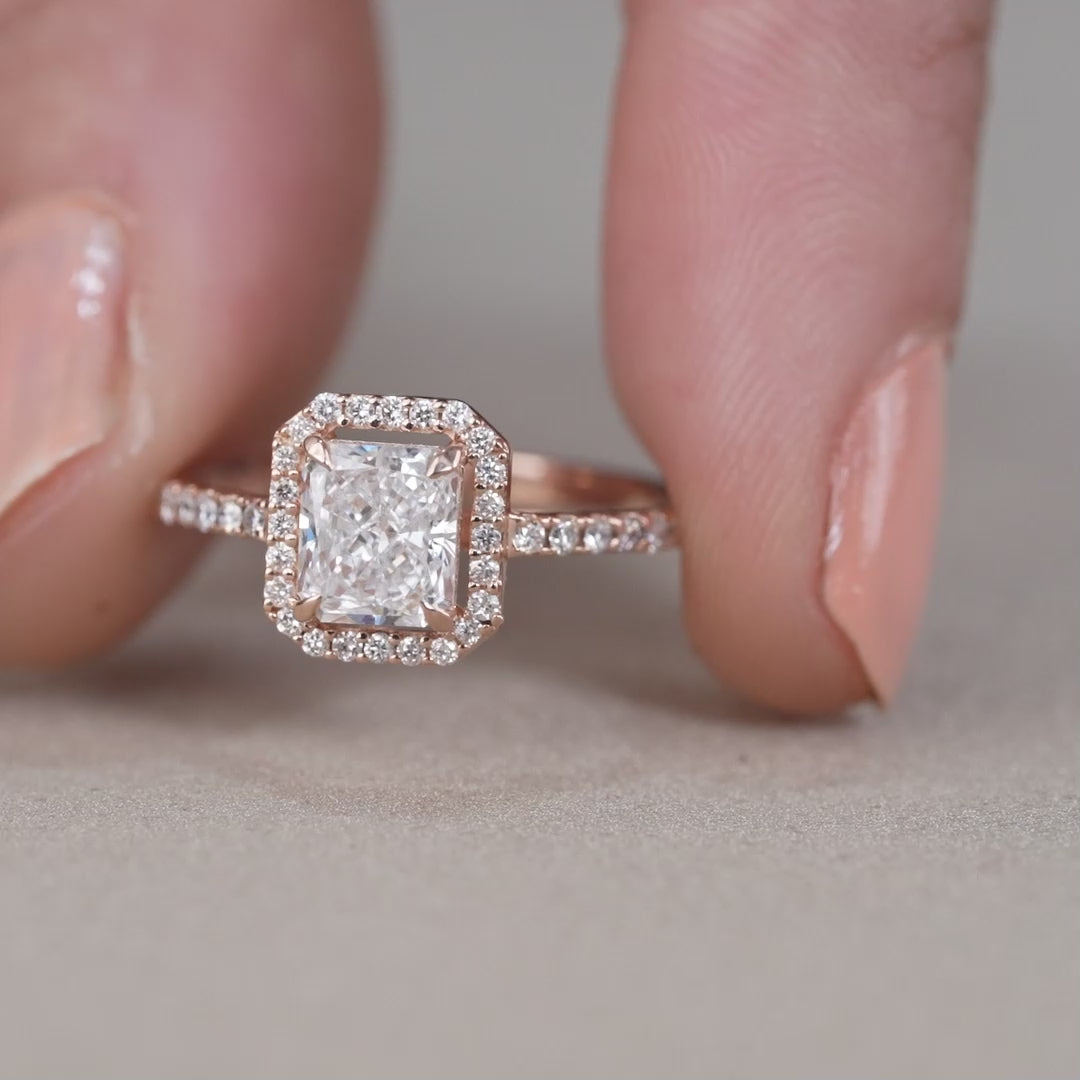 Elegant radiant lab grown diamond ring with pavé halo frame