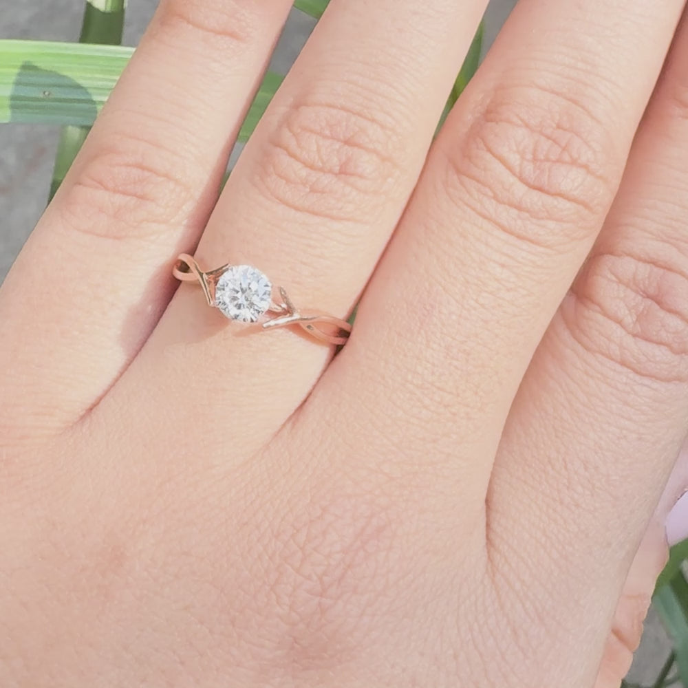 Rose gold solitaire ring with round lab grown diamond and twisted band design