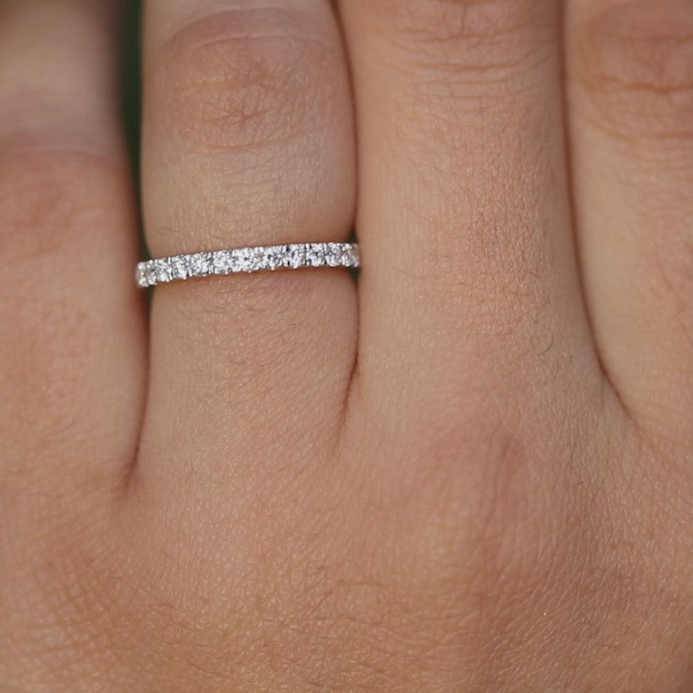 Fine yellow gold band adorned with sparkling round diamonds arranged in a continuous pavé setting.