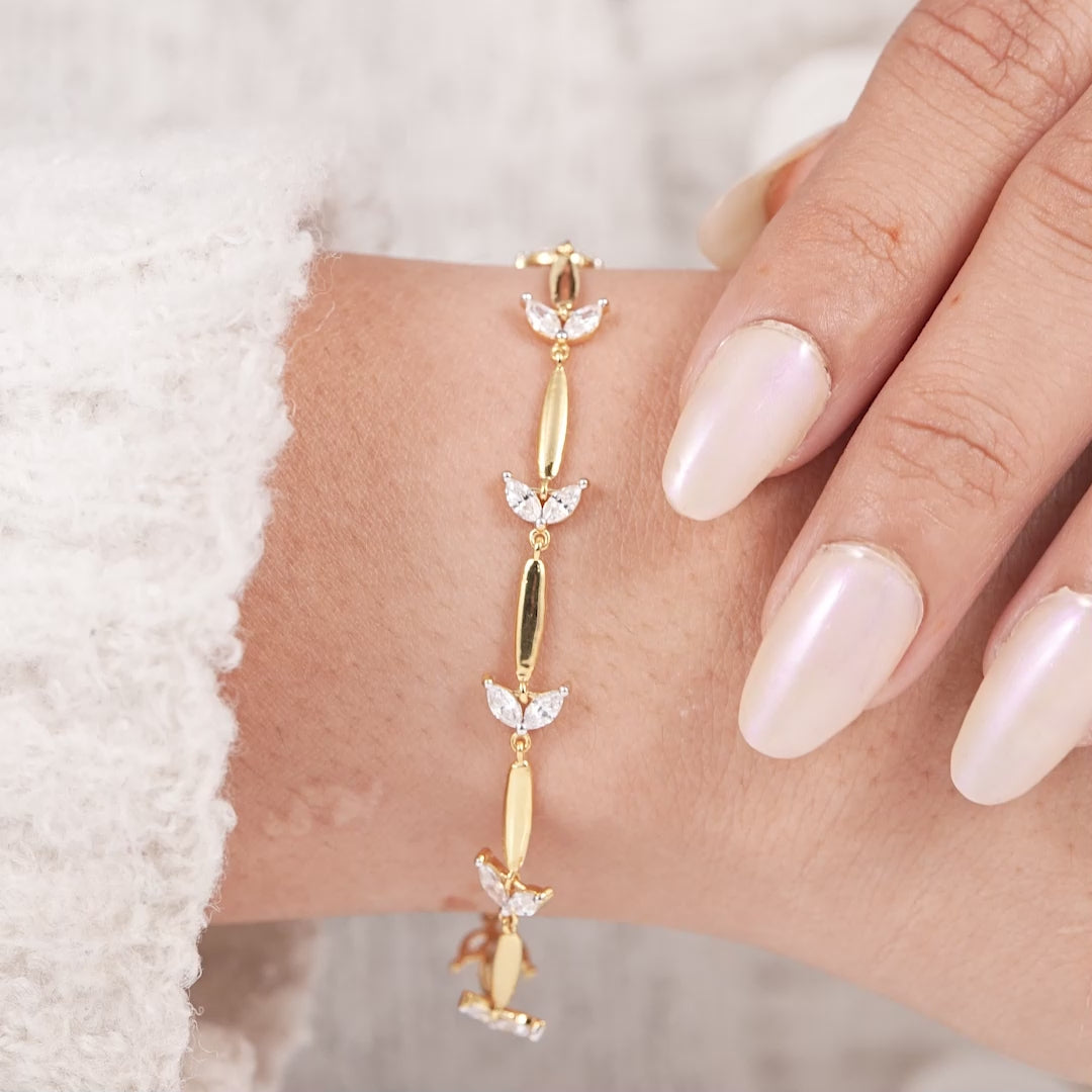 Dainty marquise cut diamond bracelet with floral inspired gold links
