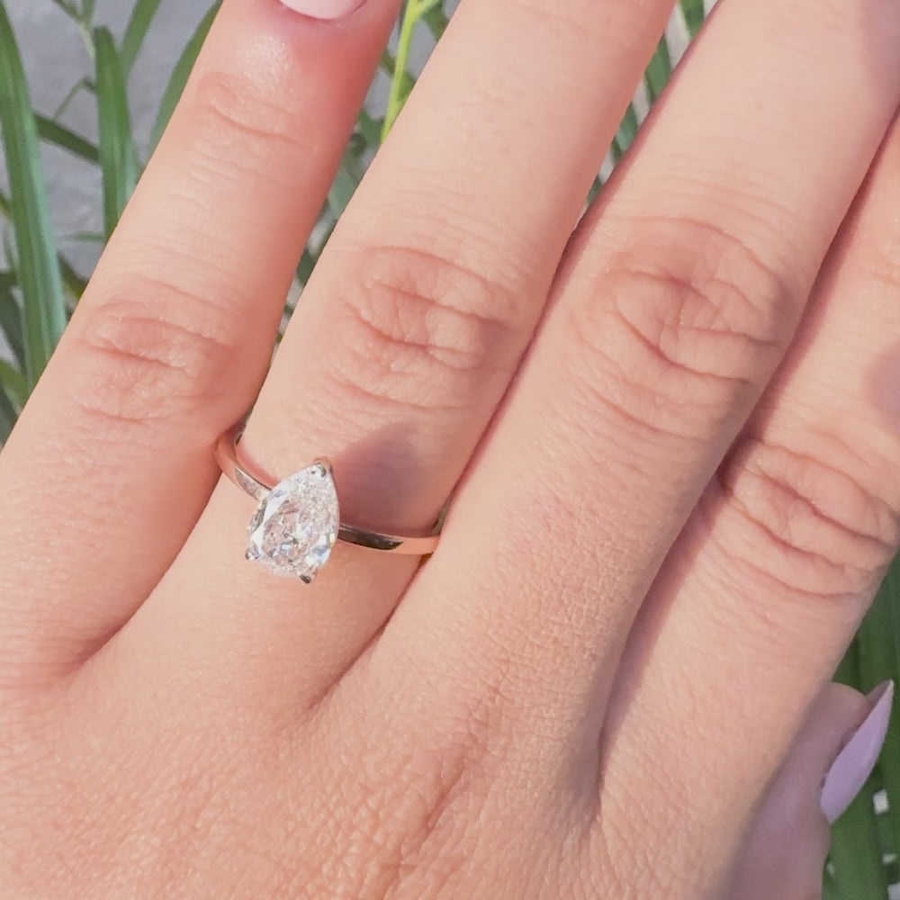 Pear cut lab grown diamond solitaire ring with minimalist band