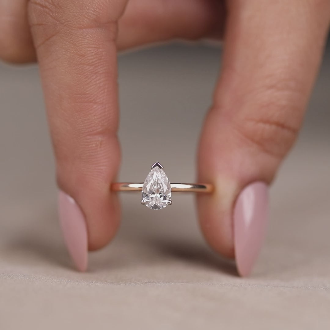 Elegant solitaire ring featuring pear lab created diamond anniversary