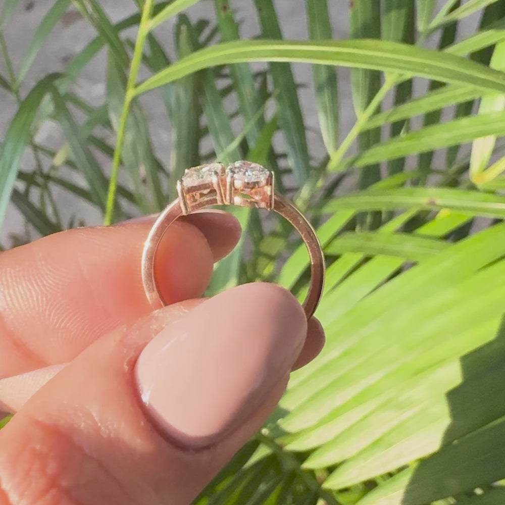 Two stone engagement ring with radiant cut and pear cut lab grown diamonds