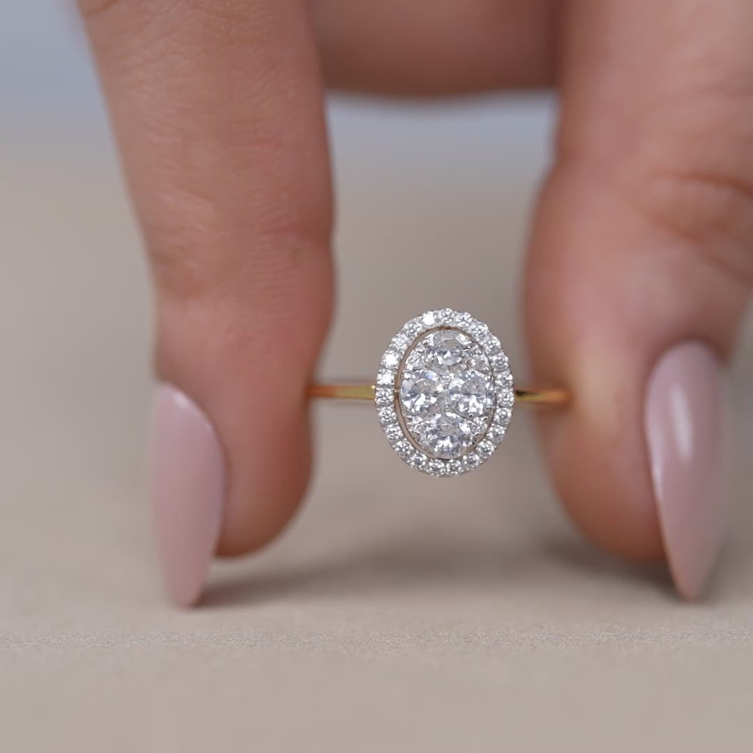 Vintage oval diamond cluster ring with pavé halo and polished gold band