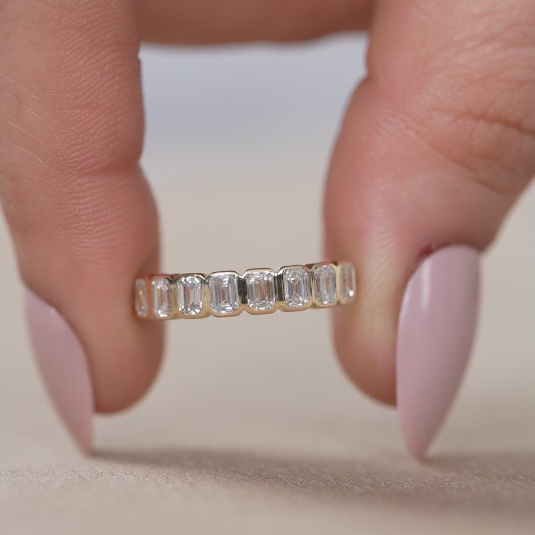 Emerald cut bezel set diamond ring with lab grown diamonds for wife