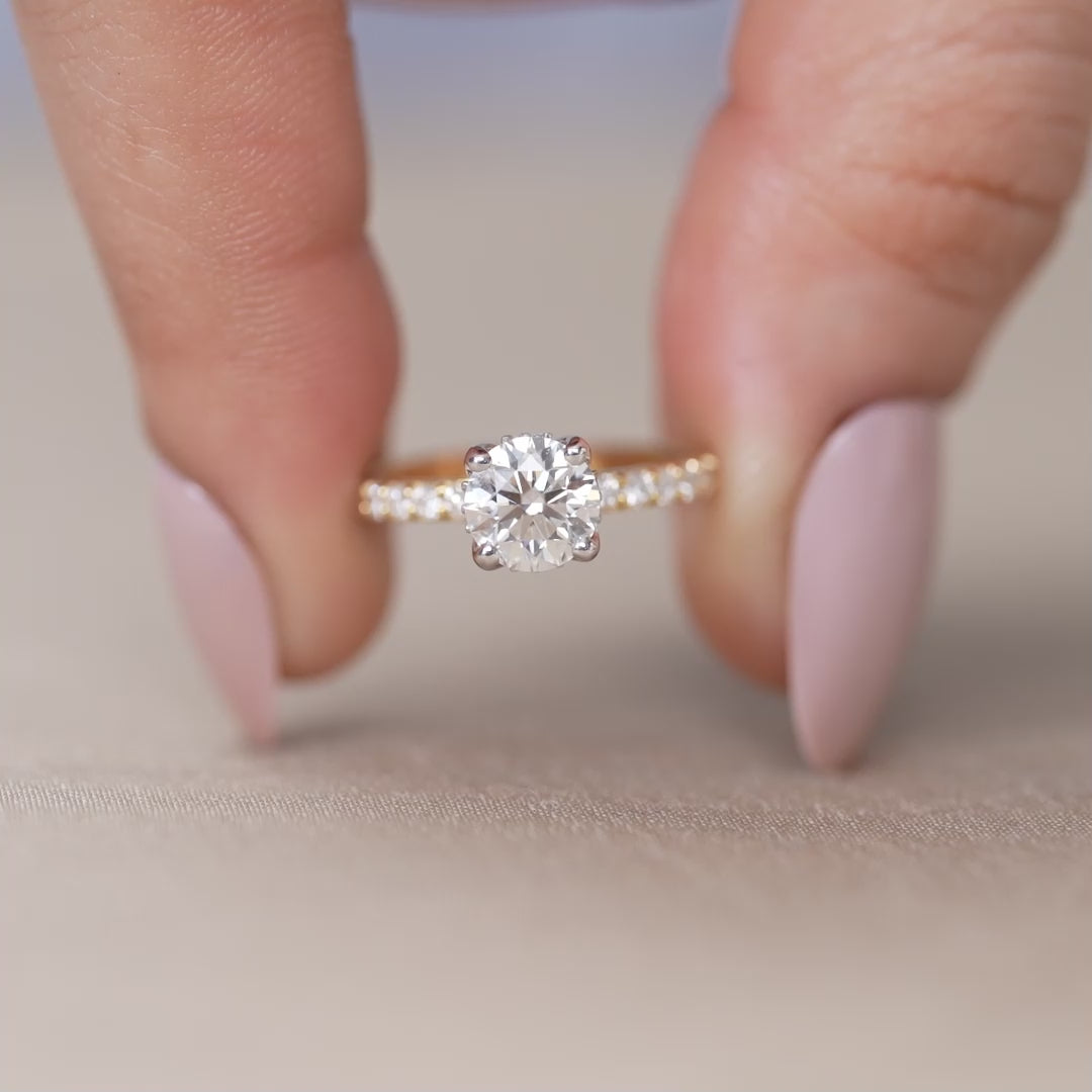 Yellow gold solitaire ring with round lab grown diamond and pavé