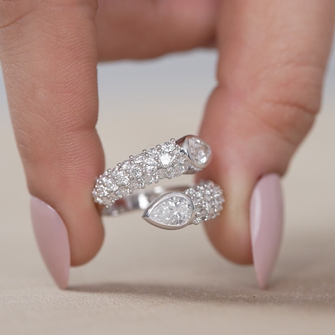 Modern open ring showcasing pear shaped lab grown diamonds and pavé band