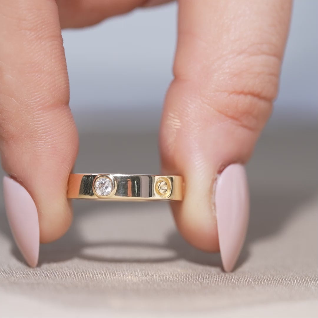 Minimalist lab grown diamond band with modern screw motif design