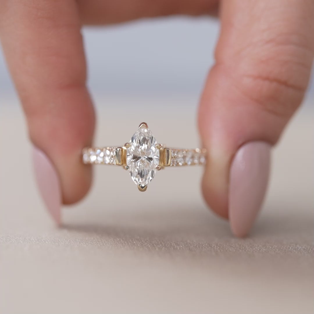 Elegant marquise lab grown diamond solitaire with sparkling pavé shoulders