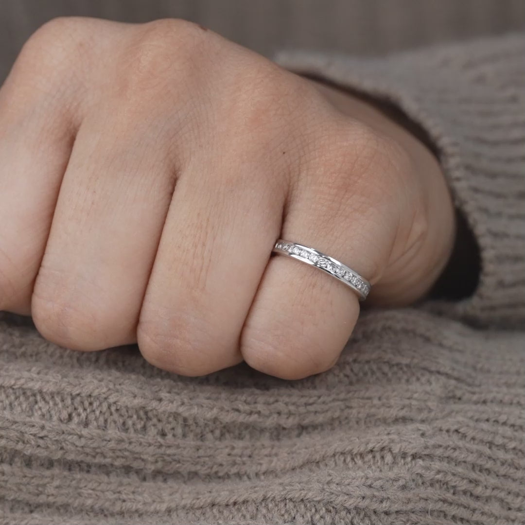 Elegant white gold band featuring channel set lab grown diamonds