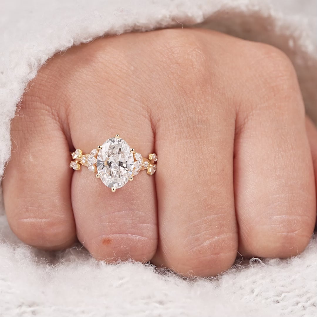 Oval lab diamond engagement ring with hidden halo and floral marquise vine accents