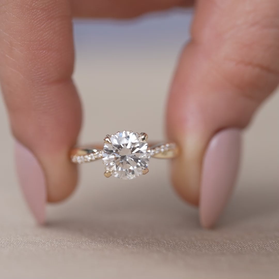 Elegant round lab grown diamond ring with pavé twist shank