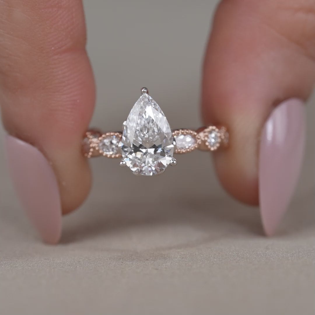 Rose gold pear lab grown diamond ring with marquise accents