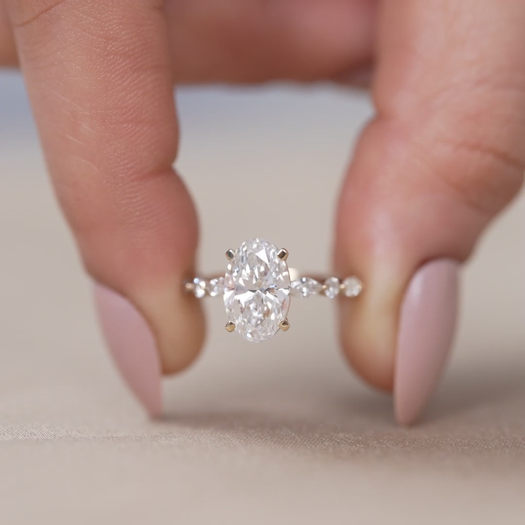 Oval cut ring featuring lab grown diamond and marquise accents