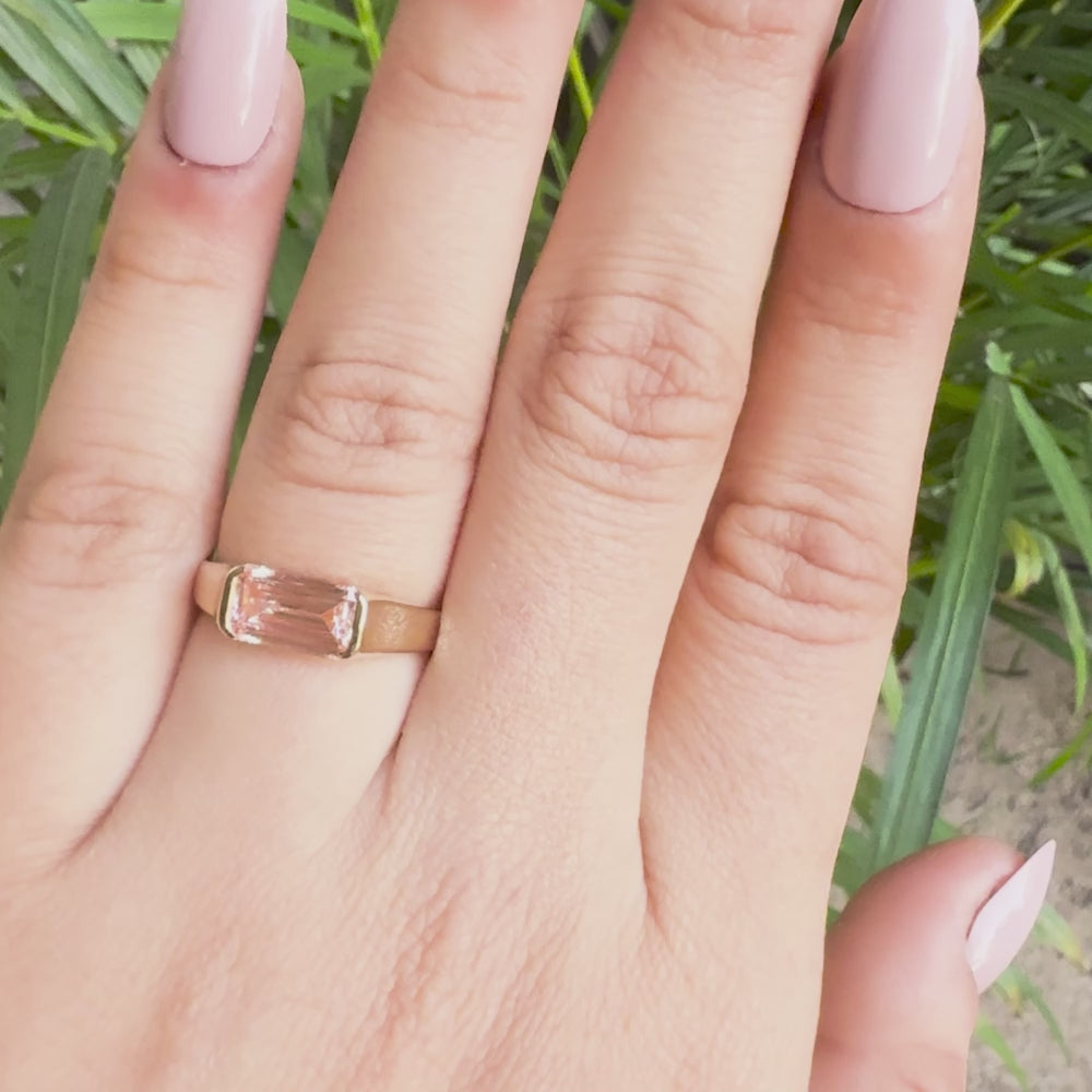 Sustainable pink emerald cut diamond engagement ring with gold band