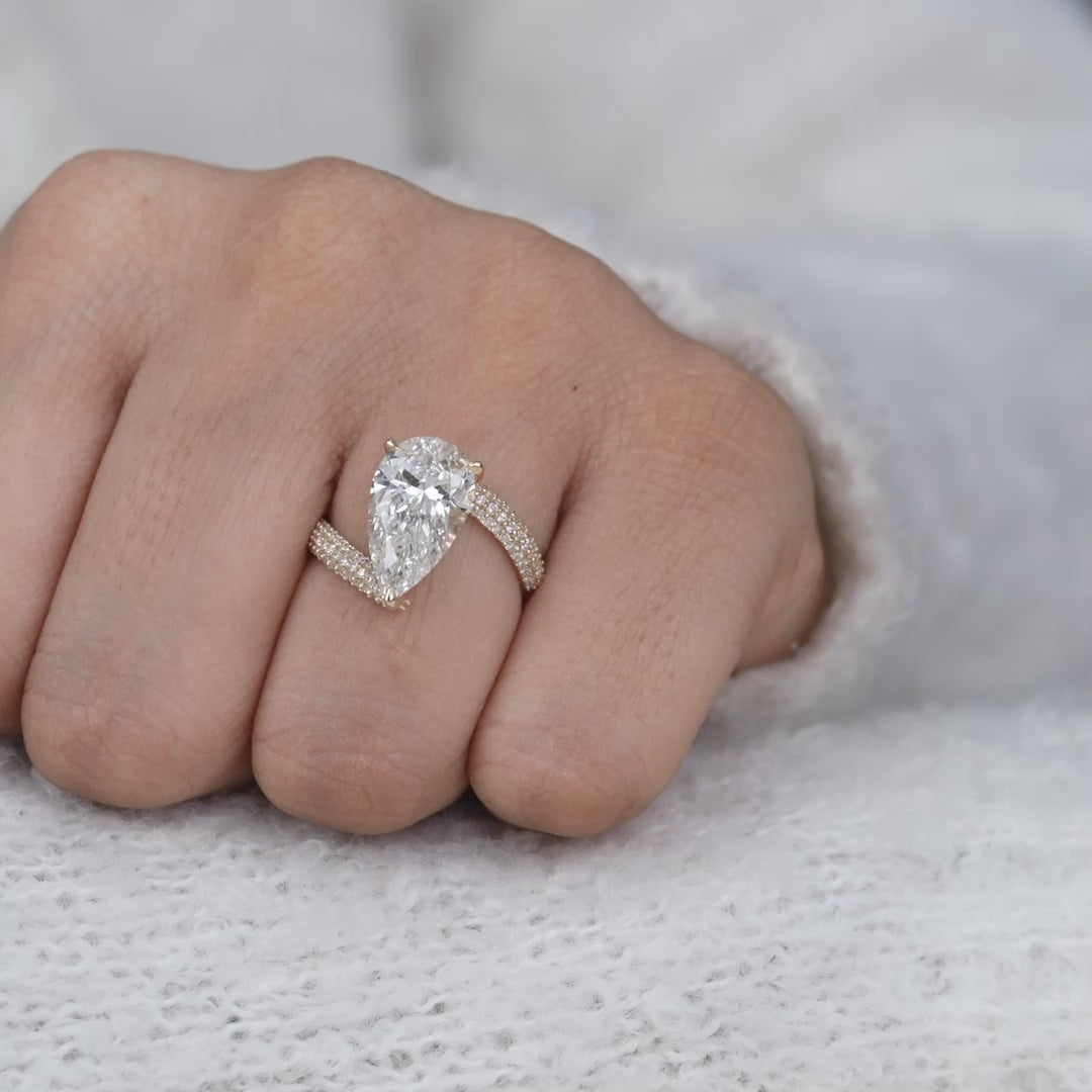 Elegant pear lab grown diamond solitaire with sparkling pavé setting