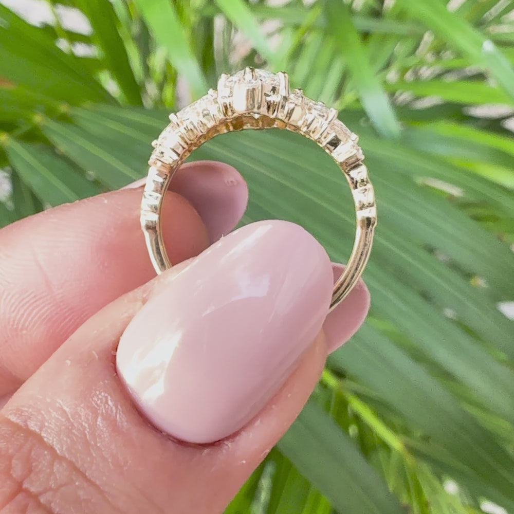 Fine jewelry marquise-cut diamond ring featuring an ornate floral diamond arrangement