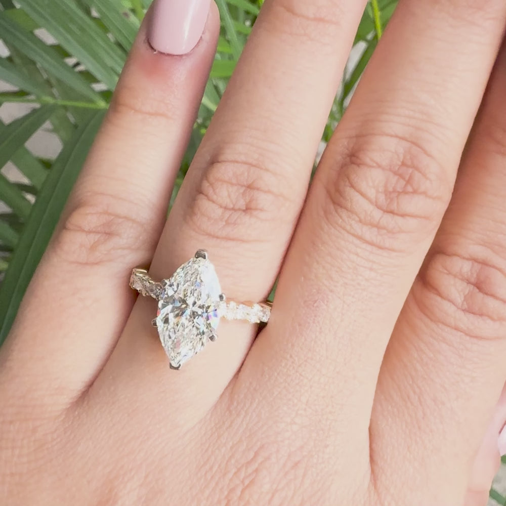 Marquise-cut lab-grown diamond engagement ring with sparkling side stones