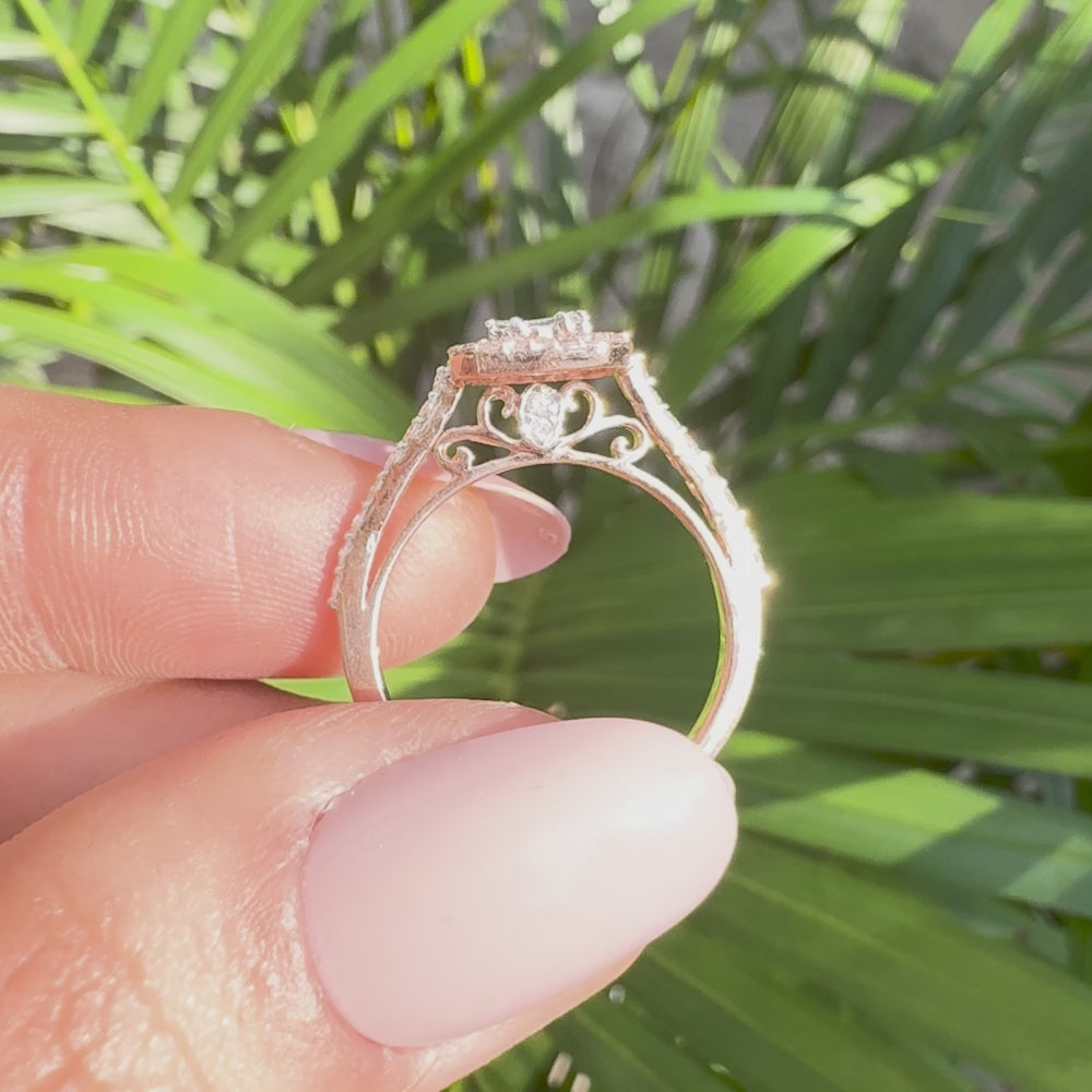 Vintage inspired halo engagement ring with baguette lab grown diamonds in rose gold