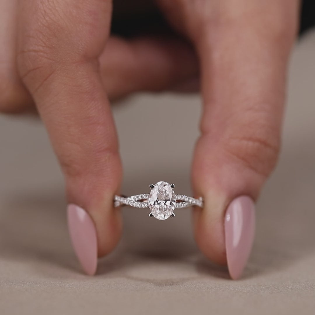 Anniversary gift ring featuring oval lab created diamond