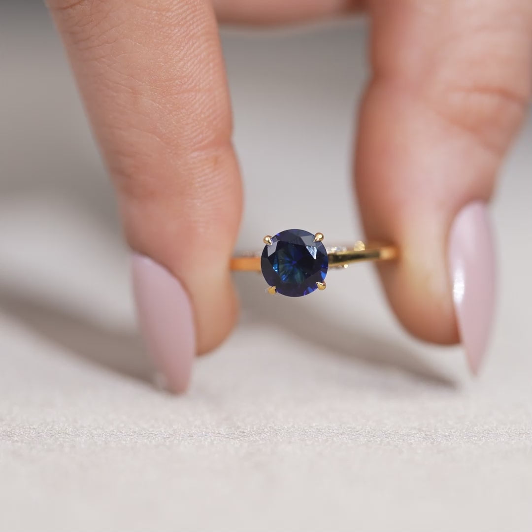 Elegant blue sapphire engagement ring with minimal gold band
