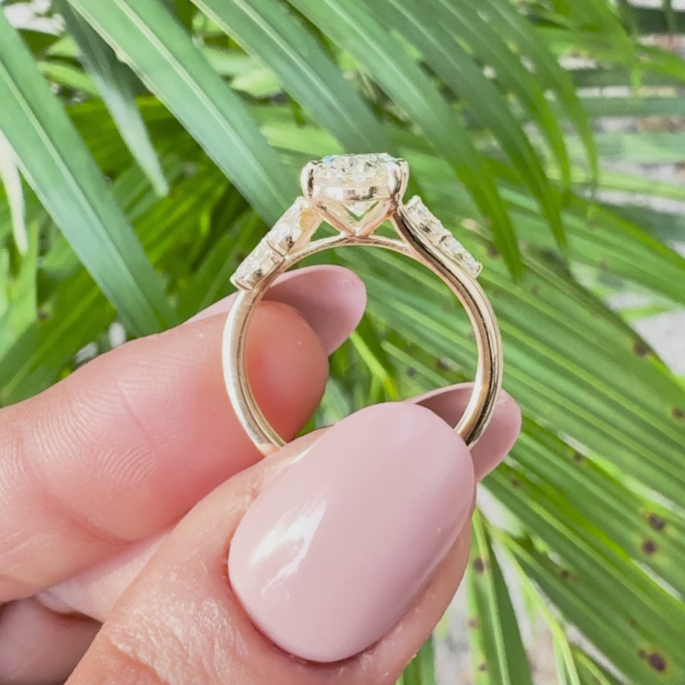 Fine jewelry oval cut diamond ring with marquise side diamonds