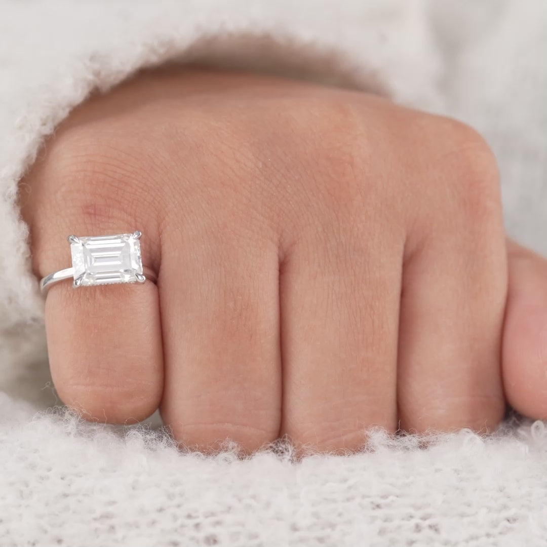 Hidden Halo Emerald Cut Solitaire Ring with Modern Minimal Design