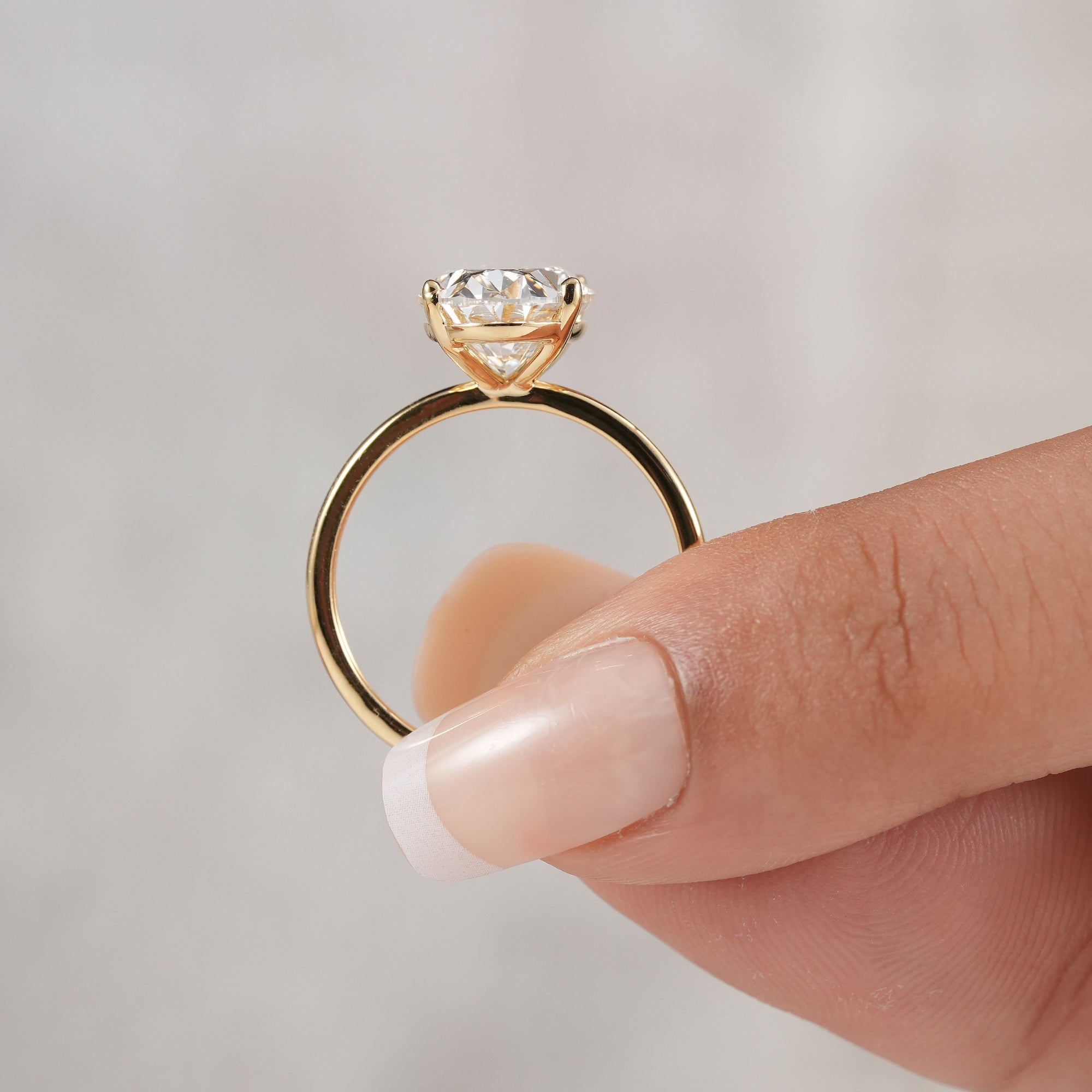 Side view of oval lab grown diamond engagement ring setting.